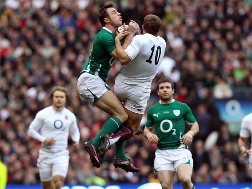 Tommy Bowe and Jonny Wilkinson battle for posession at Twickenham