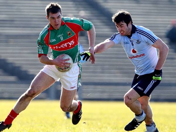 Mayo's Seamus O'Shea attempts to evade Michael McAuley of Dublin