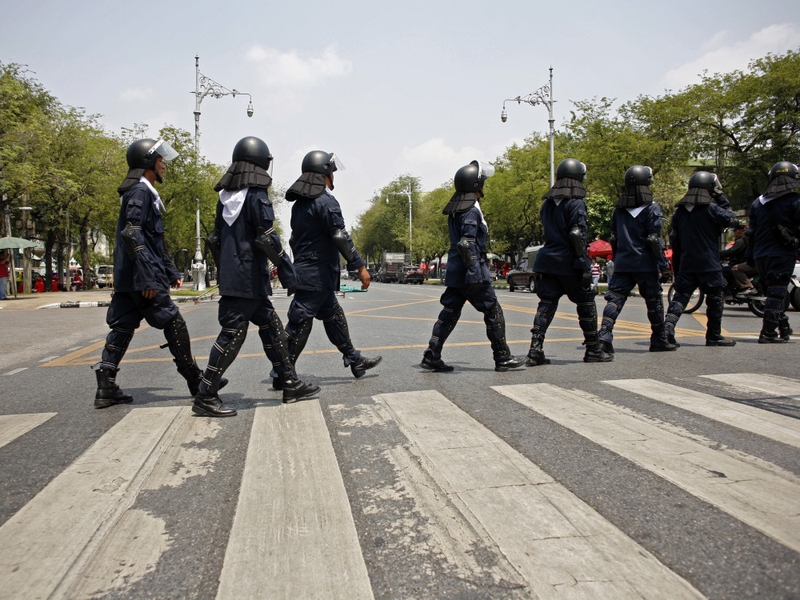 Bangkok - Police officers patrol with riot gear