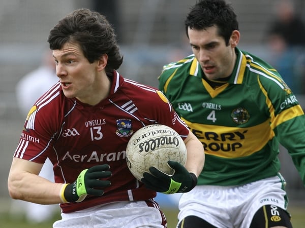 Galway's talismanic Michael Meehan shields the ball from Kerry's Tom O'Sullivan