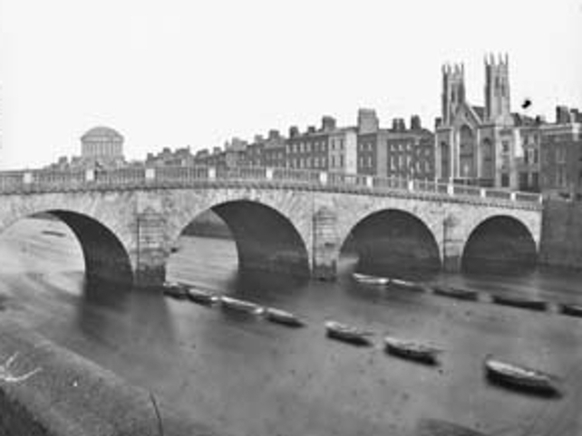 Old Wellington Bridge (later replaced by Grattan Bridge) leading to Capel Street. 1860-1890