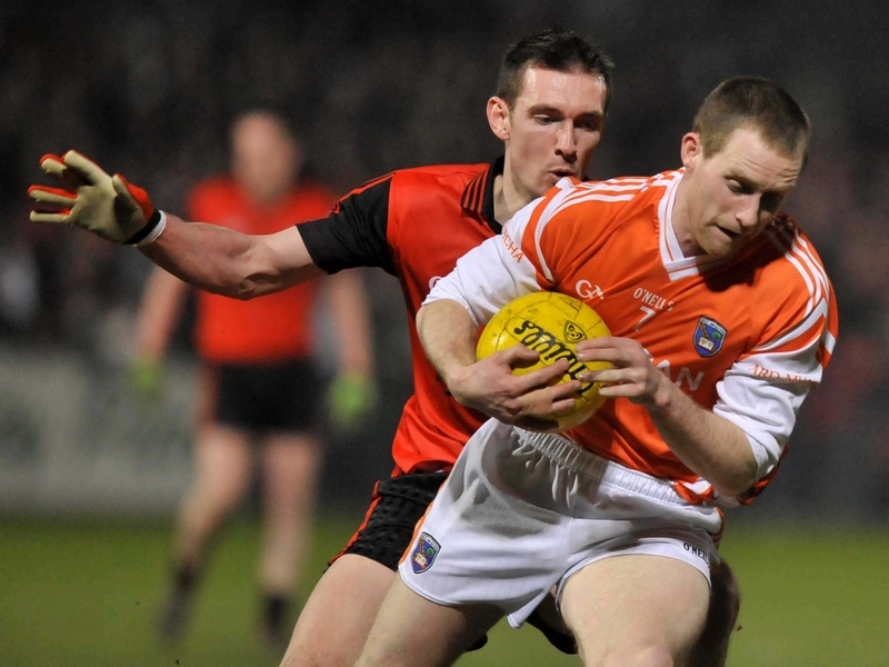Armagh's Finian Moriarty with Down's Stephen Kearney