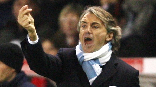 Roberto Mancini's Manchester City have halted Chelsea's unbeaten run