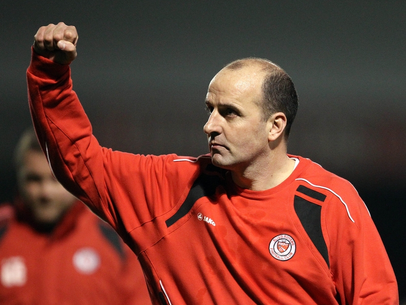 Paul Cook has signed Jim Lauchlan and Lee McEvilly