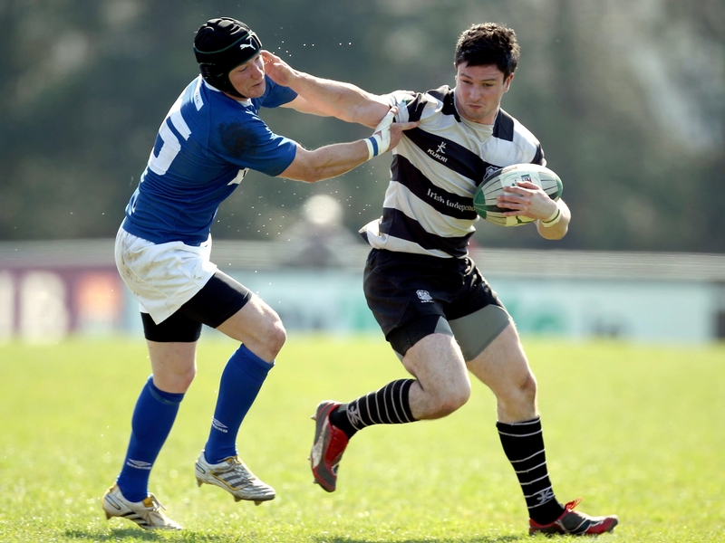 Gavin Dunne of St Mary's attempts to stall the progress of Old Belvo's Dave Mongan in the AIB League Division 1 semi-final at Templeville Road