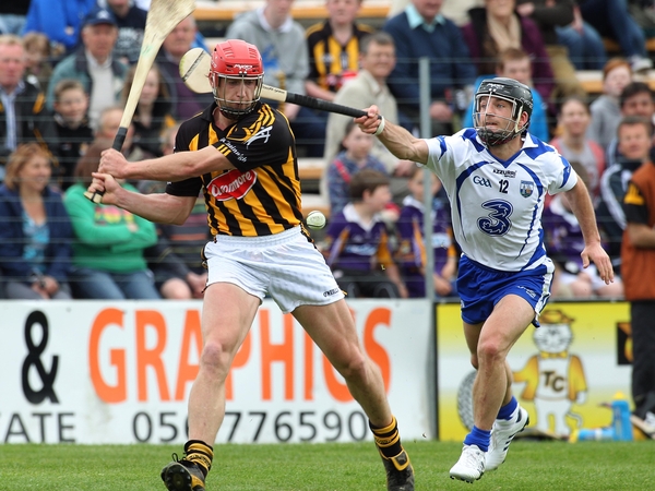 John Tennyson gets his shot away despite the attention Waterford's Eoin McGrath