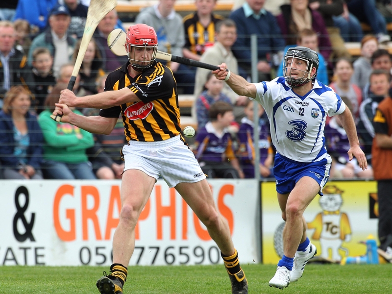 John Tennyson gets his shot away despite the attention Waterford's Eoin McGrath