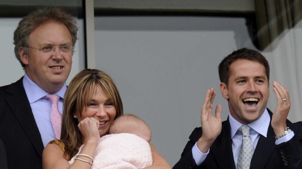 Betfair co-founder Andrew Black looks on as Michael Owen and his wife celebrate Julius Geezer's win in the opener