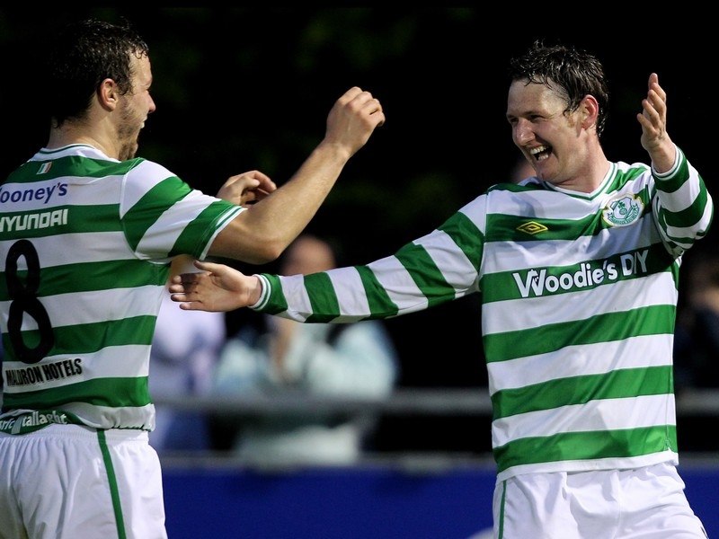 Gary Twigg celebrates his late winner for the Hoops with fellow goalscorer James Chambers