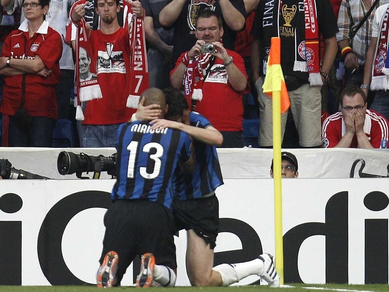 Inter players celebrate with goalscorer Diego Milito