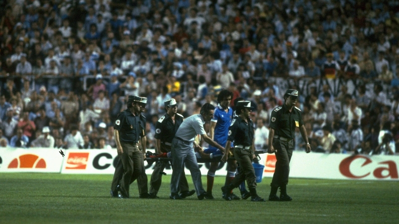 Patrick Battiston is stretchered off - concussed and missing teeth