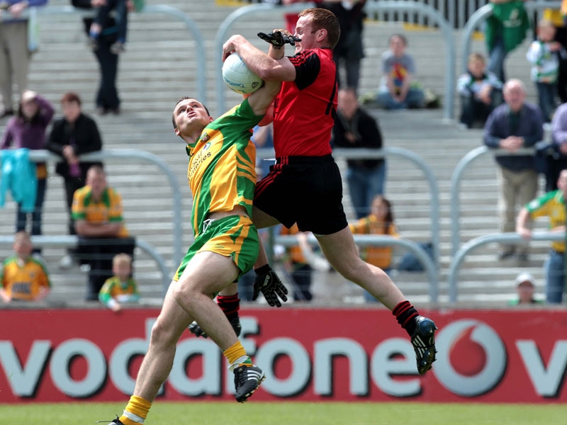 Down's Brendan 'Benny' Coulter battles with Neil McGee of Donegal