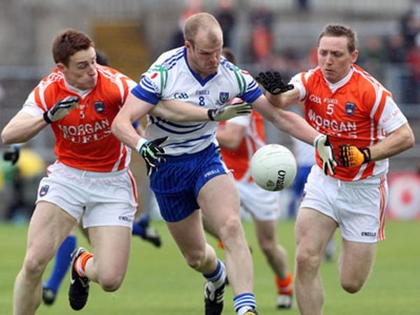 Monaghan's Dick Clerkin fends off Armagh's Charlie Vernon and Paul Duffy