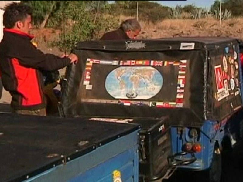 Around the World - Matias and Mario keeping their car in good shape
