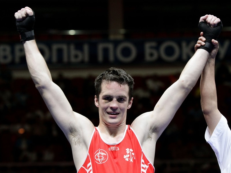 Darren O'Neill's hand is raised aloft in victory