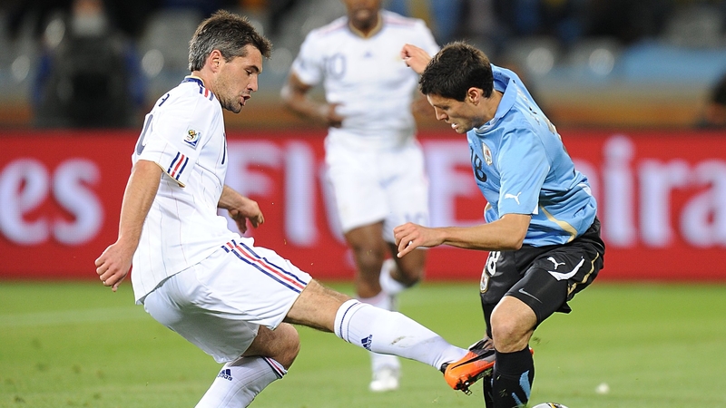 Uruguay's Nacho Gonzalez and Jeremy Toulalan of France in action at the Green Point Stadium