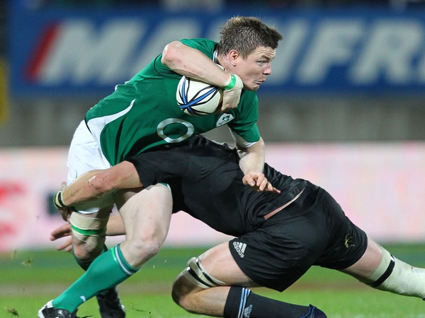 Brian O'Driscoll is tackled by Richie McCaw during Ireland's Test match in New Plymouth