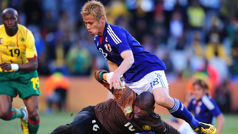 Cameroon goalkeeper Souleymanou Hamidou collides with Japan's Keisuke Honda in the Group E encounter at Bloemfontein