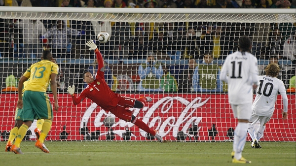 Uruguay's Diego Forlan (right) scores from the penalty spot