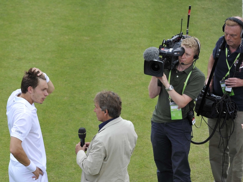 A crestfallen Nicolas Mahut tears his hair out as he's forced to endure a barrage of questions from the BBC's John Inverdale