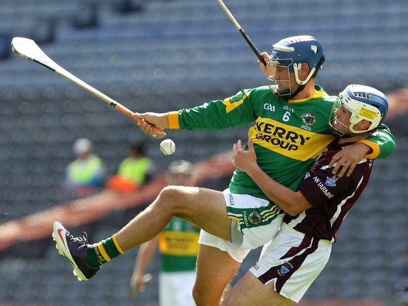 Liam Boyle of Kerry (l)and Westmeath's Brendan Murtagh end up in an unlikely embrace