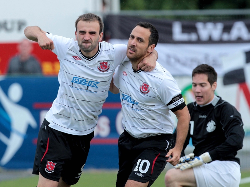 Dundalk's Fahrudin Kudsovic congratulates Neale Fenn after he scored from the penalty spot