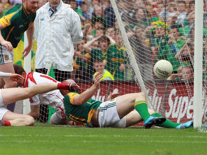 Joe Sheridan gets the ball across the Louth goal-line for the controversial decisive score