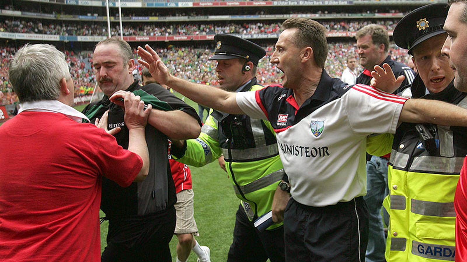 Fitzpatrick tries to put himself between fans and referee Martin Sludden