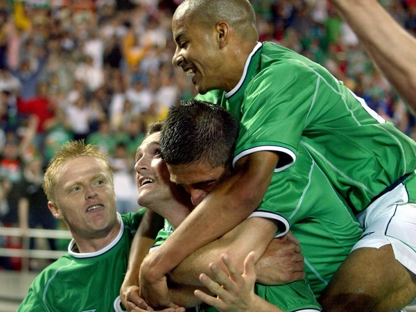 Stephen Reid (top), Niall Quinn and Damien Duff mob Robbie Keane after his late equaliser against Germany in the 2002 World Cup