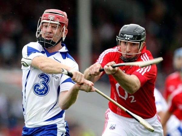 John Mullane gets a strike on the ball despite the attention of John Gardiner at Semple Stadium