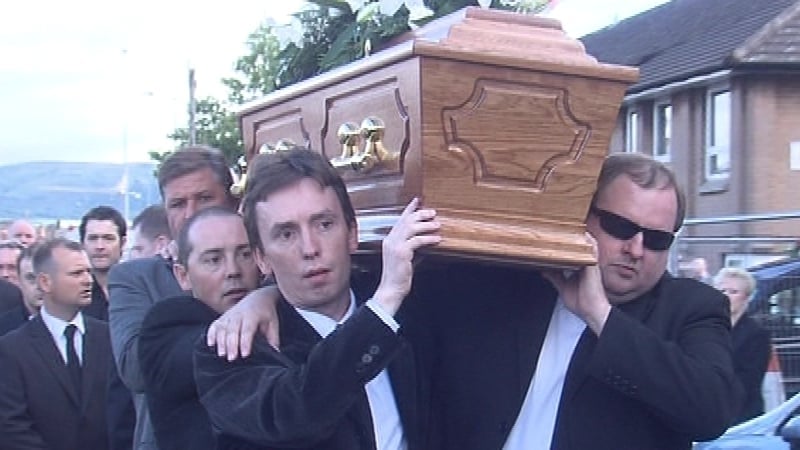 Belfast - Ken Doherty helps carry the coffin of Alex Higgins
