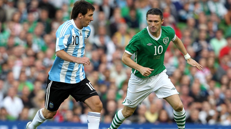 Lionel Messi and Robbie Keane