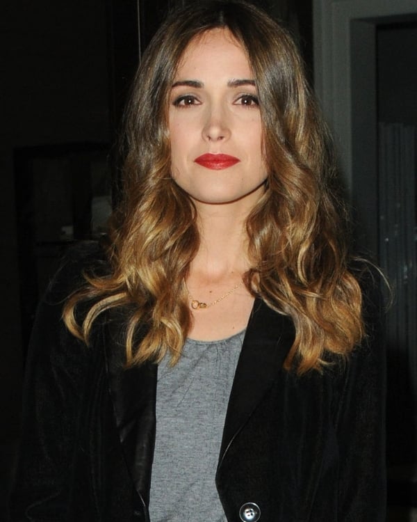 A bold red lip compliments the simplicity of the outfit