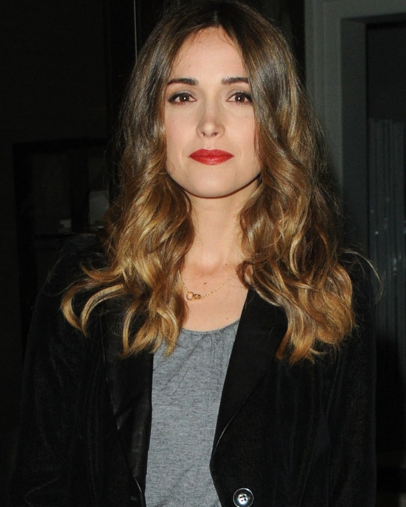 A bold red lip compliments the simplicity of the outfit