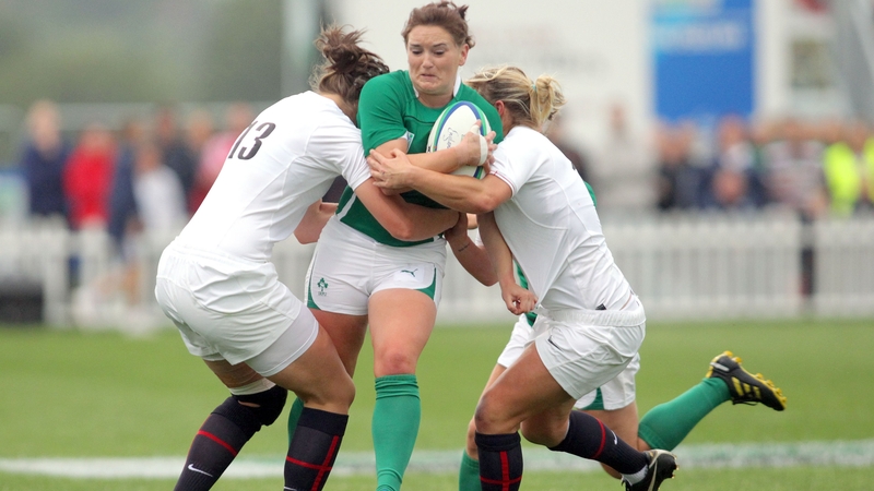 Joy Neville tries to break through the tackle of Emily Scarratt and Rachael Burford