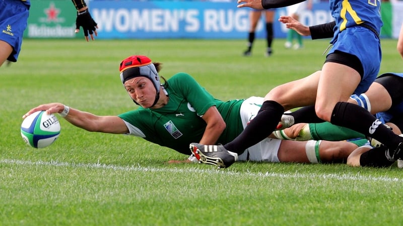 Orla Brennan stretches over the whitewash to score a try for Ireland