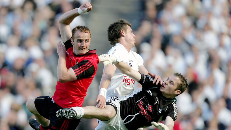 Brendan 'Benny' Coulter of Down scores his goal against Kildare. Kildare's Emmet Bolton and goalkeeper Shane McCormack try to stop him. The goal was in fact a square ball and should not have stood