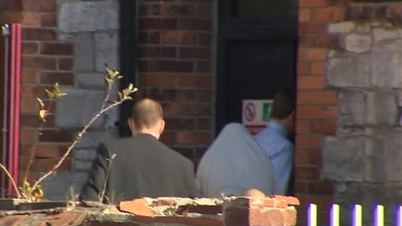 Cork - Lloyd Buckley is led inside the District Court