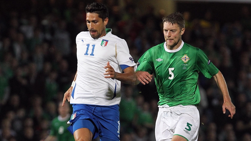 Northern Ireland's Stephen Craigan battles with Italy's Marco Borriello
