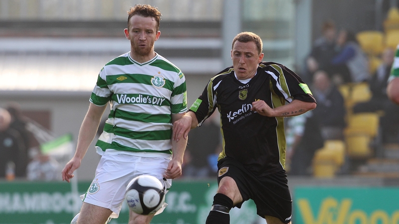 Shamrock Rovers' Aidan Price and Gary O'Neill of Sporting Fingal have their eyes on the ball at Tallaght Stadium
