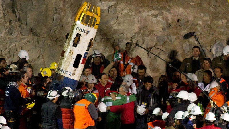 Shift supervisor Luis Urzua emerges from the mine - the final man to be rescued