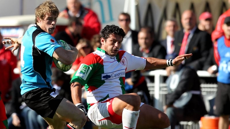 Ulster's Andrew Trimble with Benoit August of Biarritz