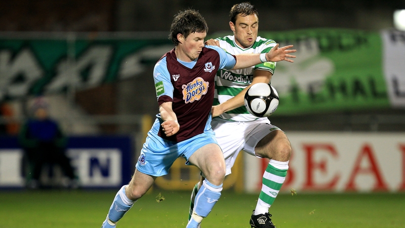 Stephen Price of Shamrock Rovers gets to grips with Drogheda United's Peter McMahon