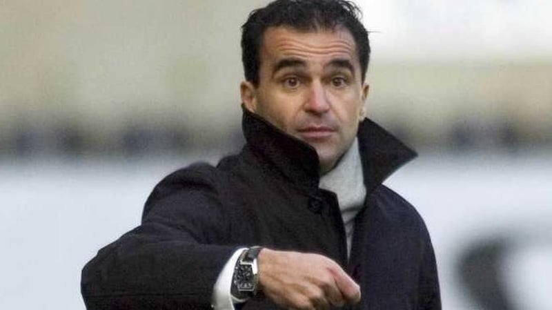 Roberto Martínez's Wigan survived a determined Hull City effort to make the fourth round