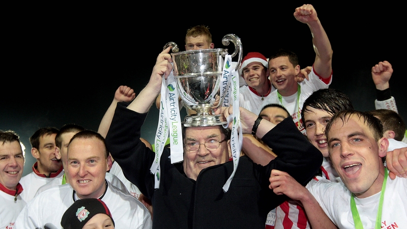 John Hume and Derry City players celebrate a return to the Premier Division