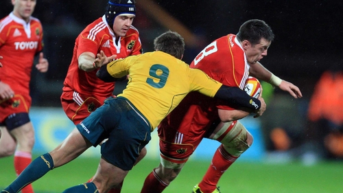 Munster's James Coughlan evades Australia's Luke Burgess at Thomond Park