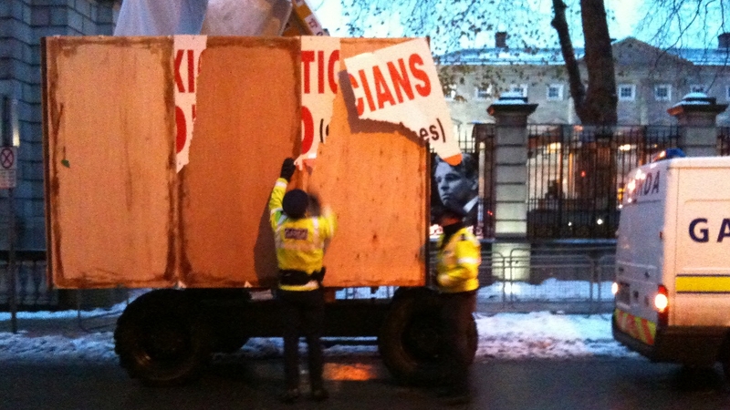 Protest - Gardaí remove placards
