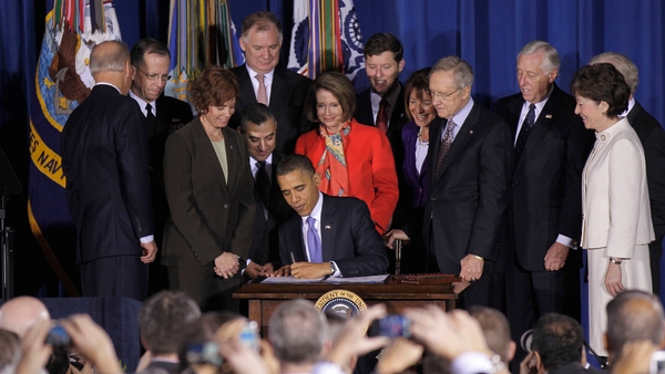 Washington - President Obama signs historic law