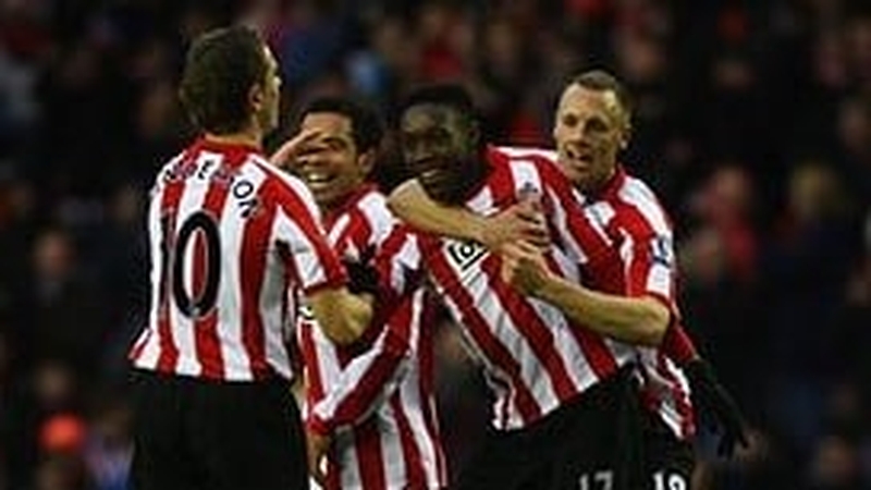 Danny Wellbeck is mobbed by team mates after his 11th minute opener
