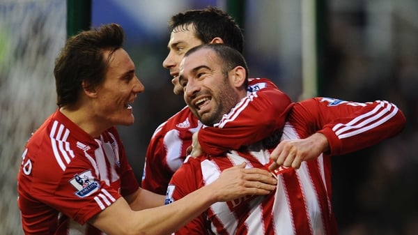 Danny Higginbotham celebrates scoring Stoke's first against Bolton